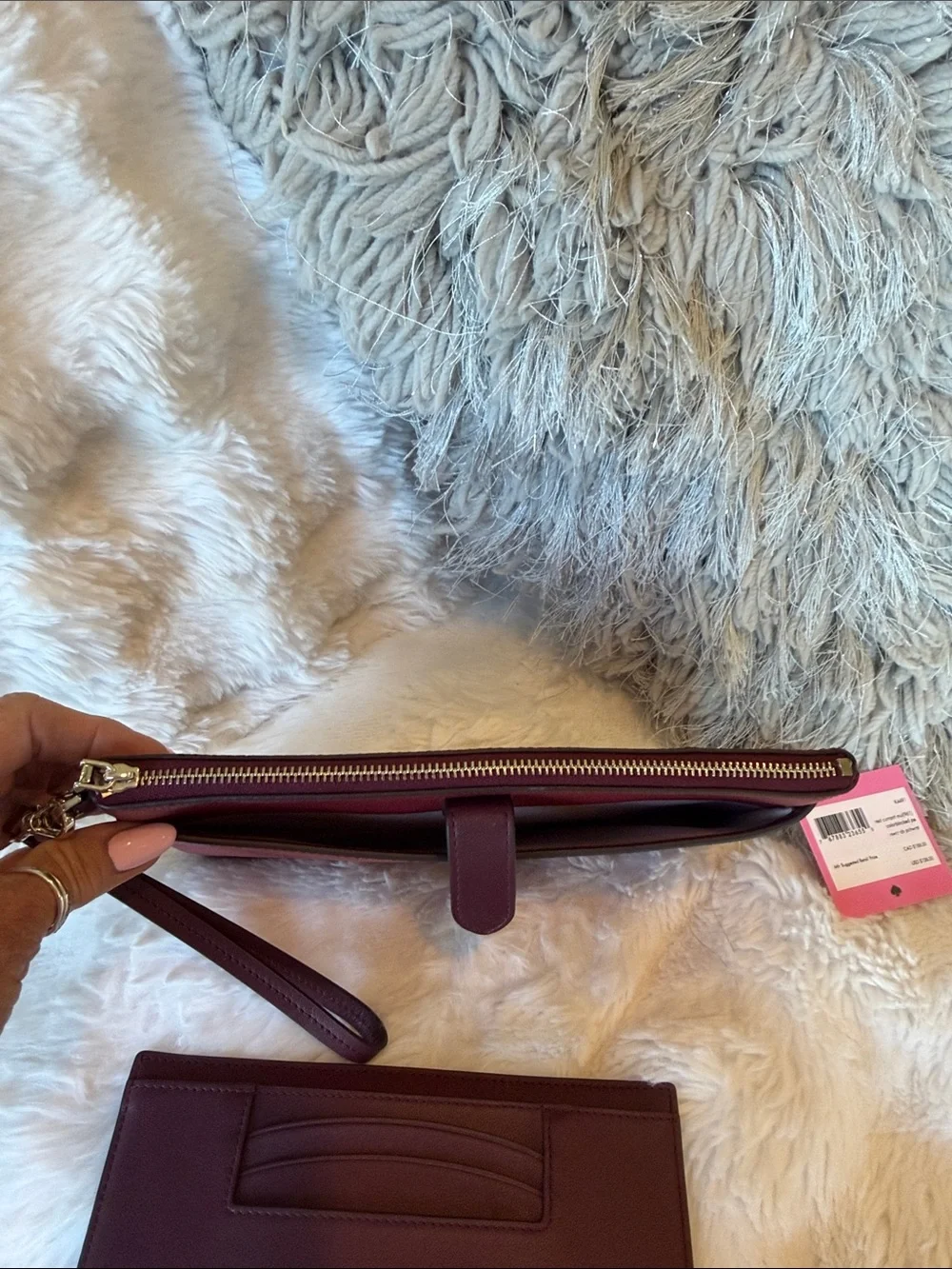 kate spade Burgundy Pebbled Leather Wristlet Clutch with Gold Tone Logo